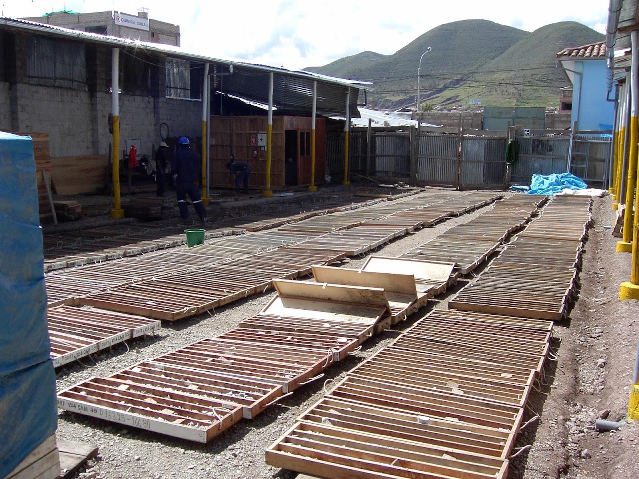 Drill core trays laid out in rows in a core yard.